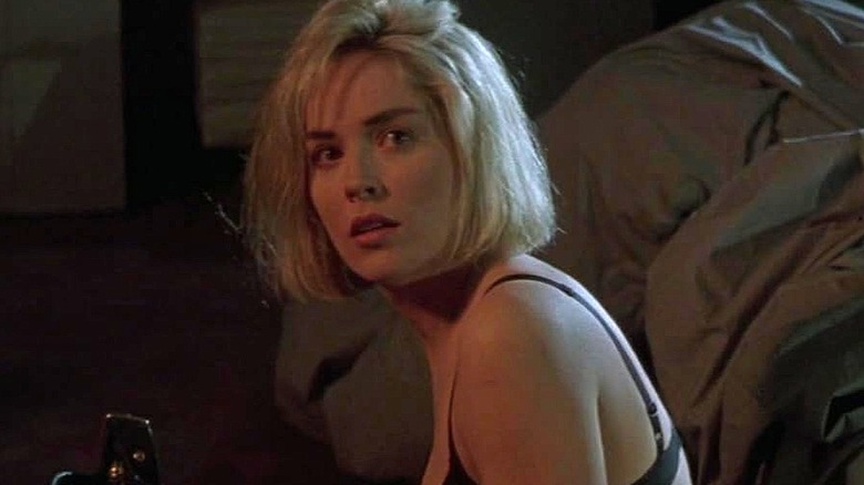 Carly Norris sitting in apartment in Sliver (1993)