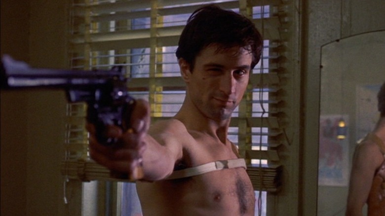 Travis Bickle aims gun