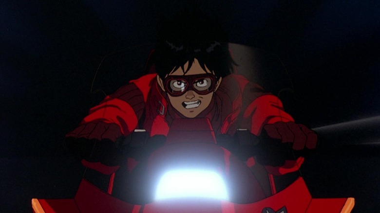 Kaneda drives his motorcycle in the opening of Akira