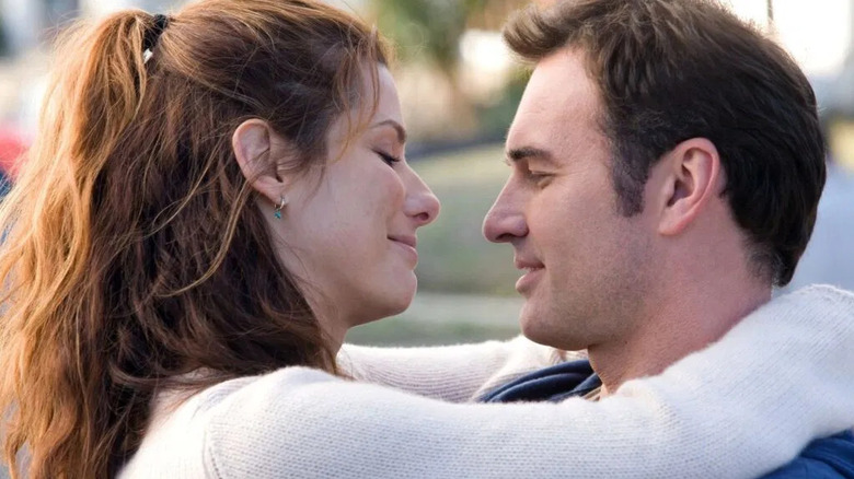 Linda and Jim embrace in Premonition