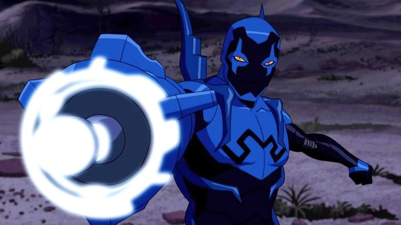 Blue Beetle prepares to fire his energy cannon in "Young Justice" (2010-2022)