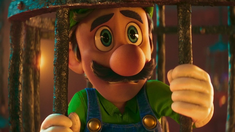 Luigi trapped in a cage in The Super Mario Bros. Movie
