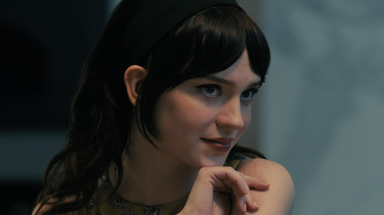 Iris smiles slyly in 
