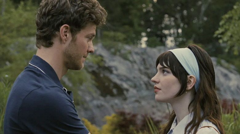 Josh and Iris talk in the forest in "Companion" (2025)