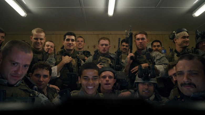 Soldiers watching a workout video in Warfare