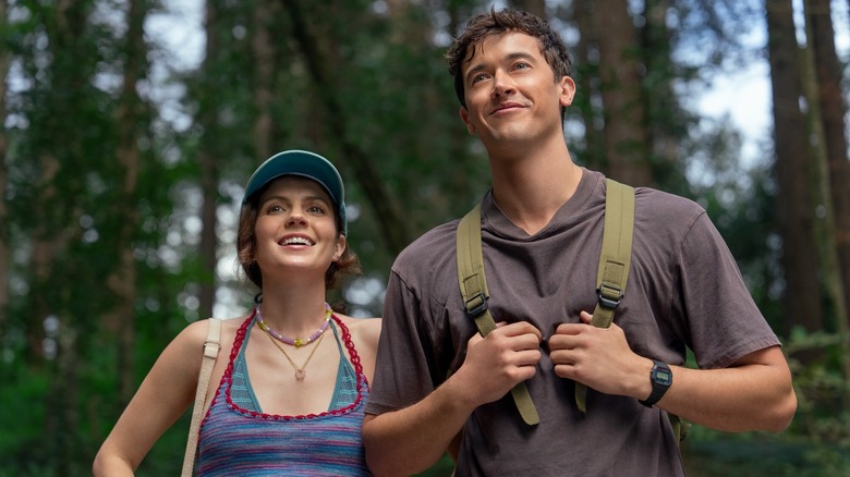 Poppy and Alex hiking and smiling in People We Meet on Vacation