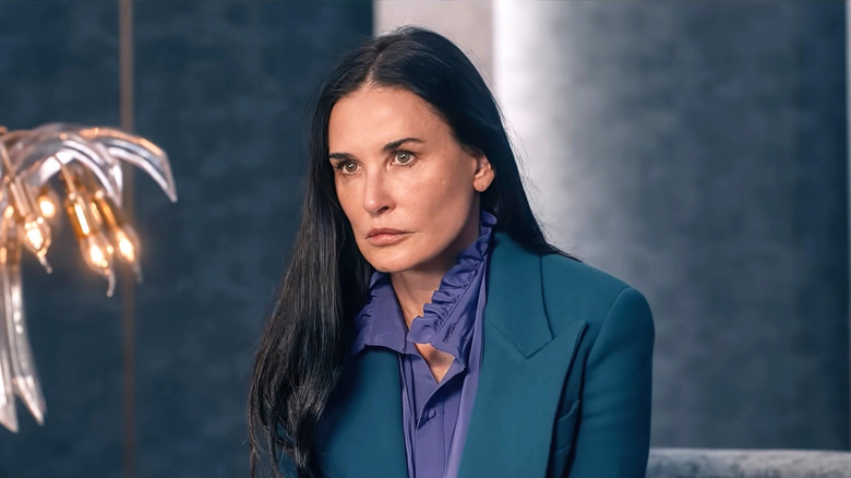 Elizabeth Sparkle in a blue suit in 