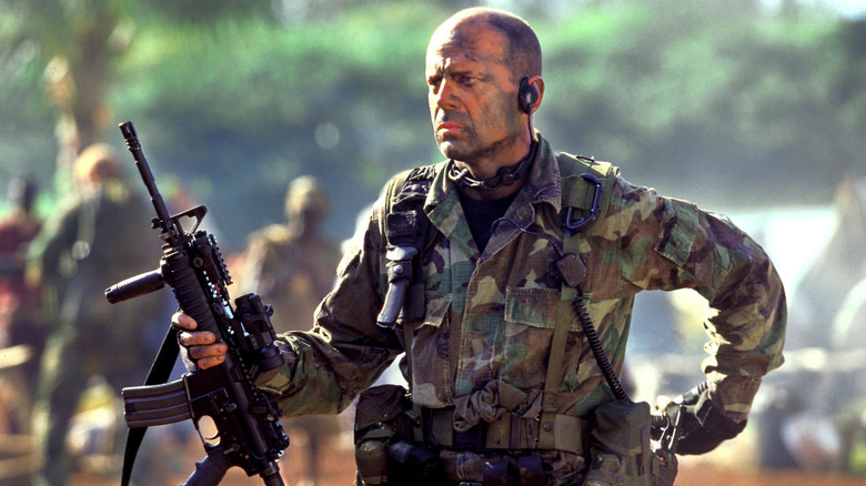 A. K. Waters with a gun in 