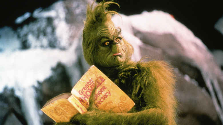 The Grinch clings to a phonebook in