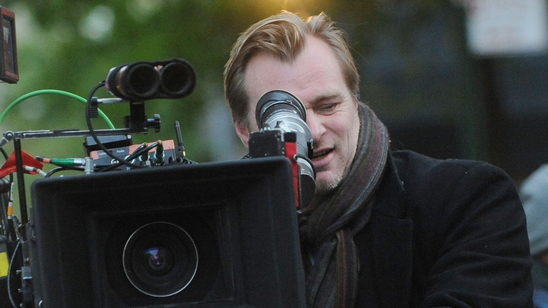 Christopher Nolan looking through camera