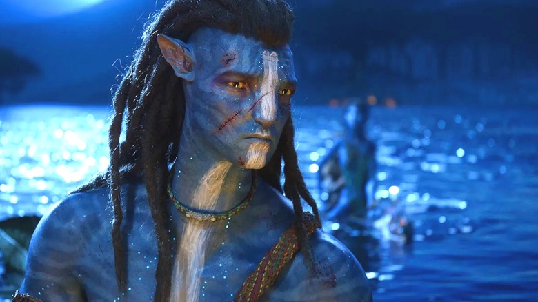 Jake in Na'vi form frowning in "Avatar: The Way of the Water."