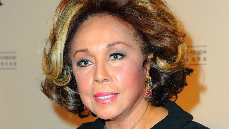 Diahann Carroll wearing purple earrings