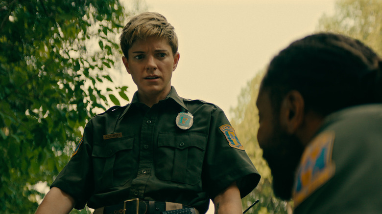 Alex looking down with a shocked expression in Wayward