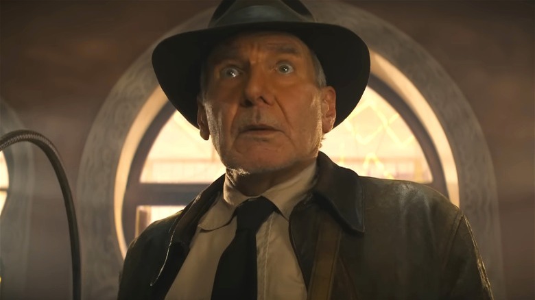 Indiana Jones holding a whip