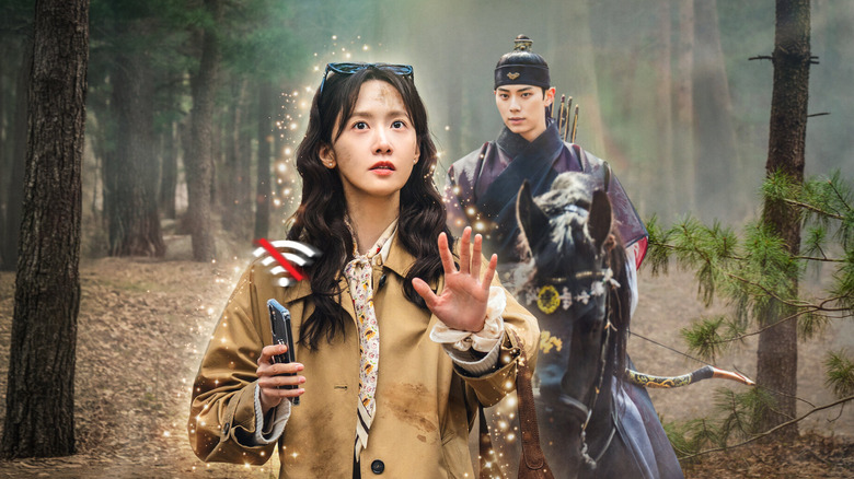 Yeon Ji-yeong stands in the forest surrounded by glowing energy in Bon Appetit, Your Majesty
