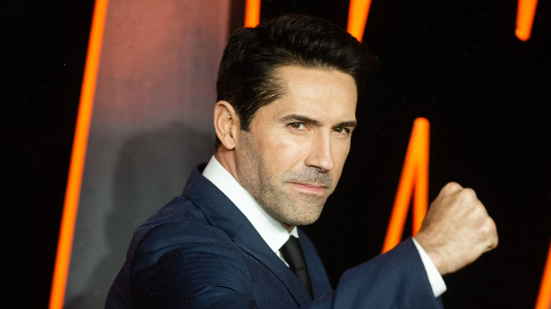 Scott Adkins poses with a balled fist