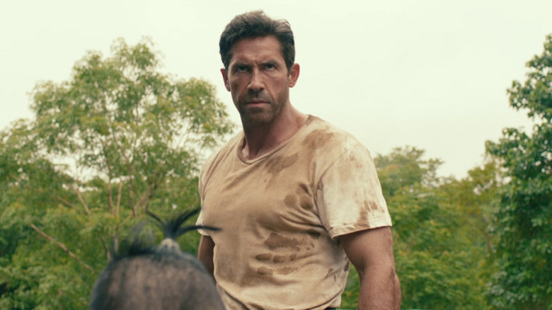 Wright with stern expression in the jungle in Prisoner of War