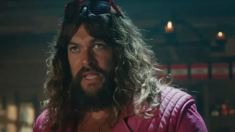 Garrett with shades on his head in A Minecraft Movie (2025)
