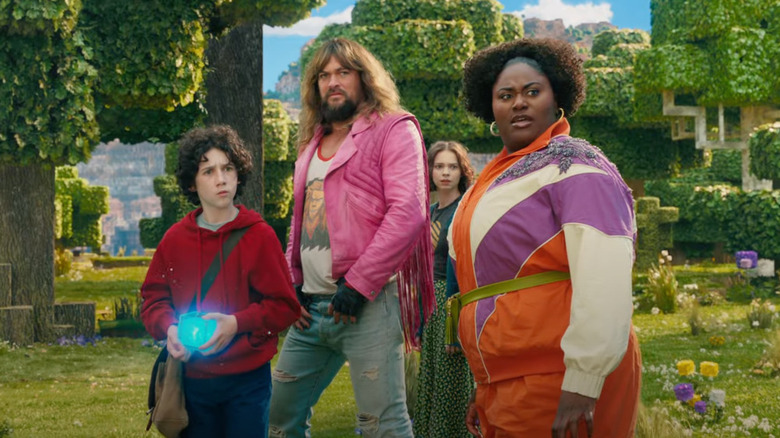 Henry, Garrett, Natalie, and Dawn wandering through the Overworld in A Minecraft Movie