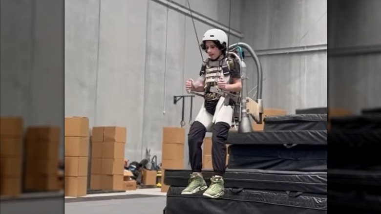 Sebastian Hansen riding a jetpack on the set of A Minecraft Movie