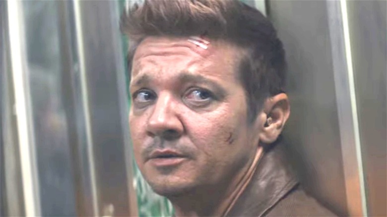 Clint Barton sitting on subway