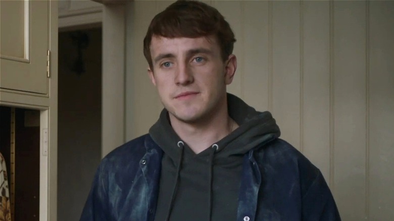 Sean standing in kitchen nervously in The Deceived