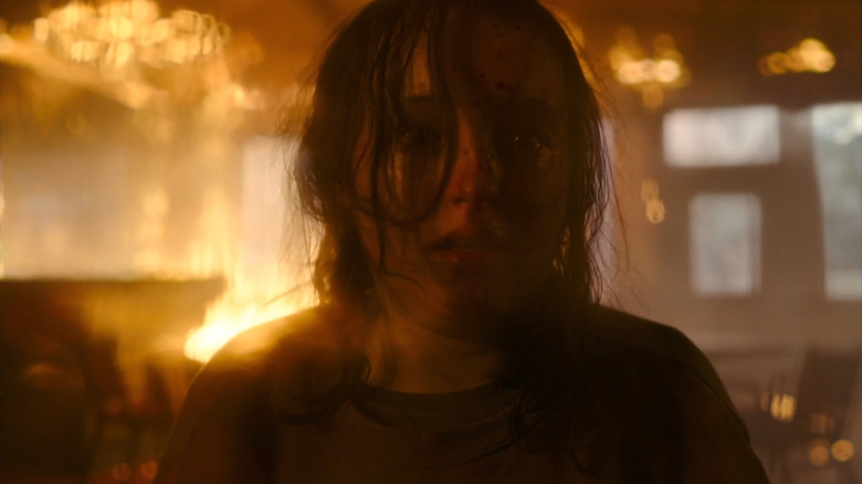 Ellie screaming with a machete 