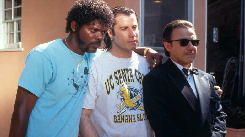 Jules, Vincent, and the Wolf standing together outside (1994)