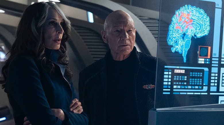 Picard and Dr. Crusher examine a medical monitor in Star Trek: Picard