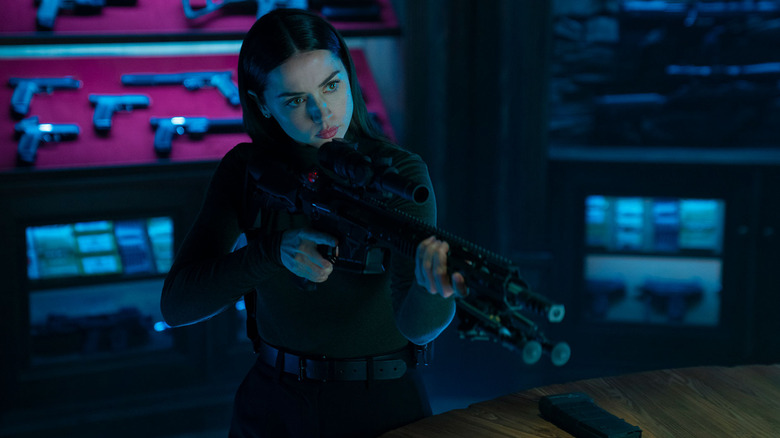 Eve pointing large gun in Ballerina
