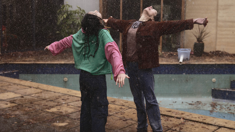 Piper and Andy standing in the rain in Bring Her Back