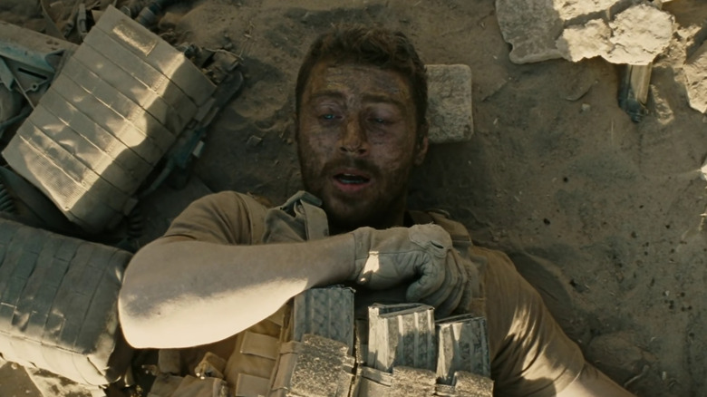 Ize laying on the ground, panicked in The Wall