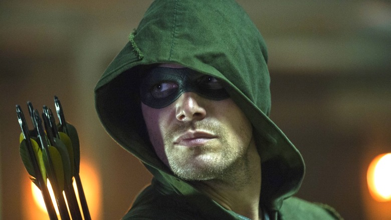 Oliver Queen looks over his shoulder on 