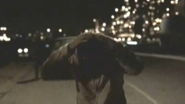 John Malkovich clutching head