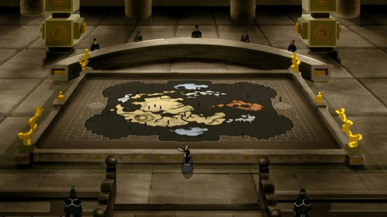 Katara studies a world map