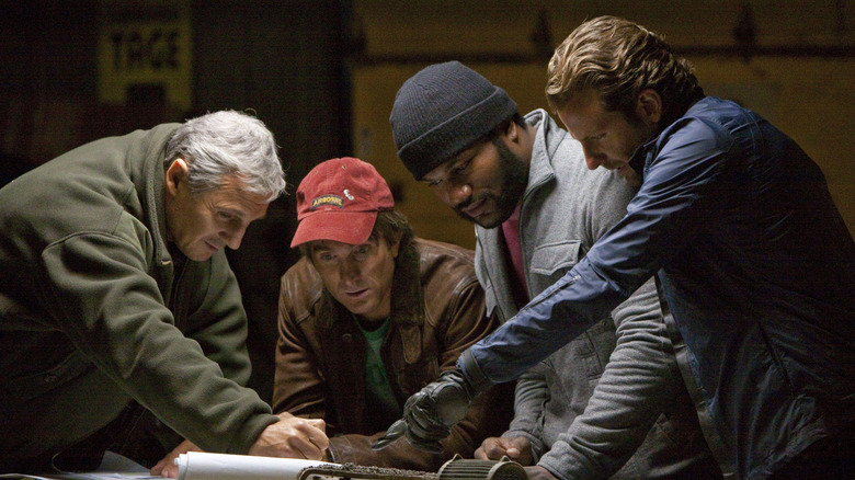 The A-Team working on a plan in a dark room in "The A-Team" (2010)