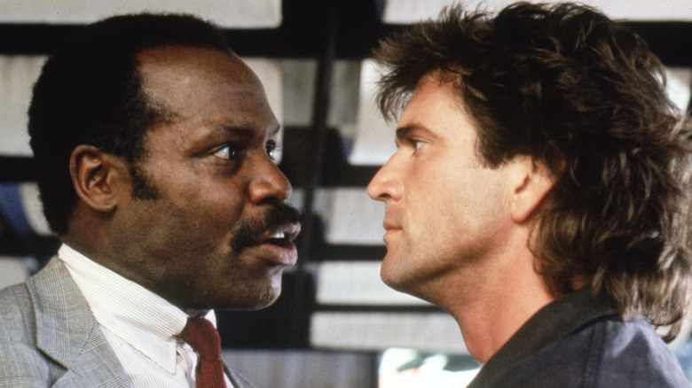 Riggs and Murtaugh squaring off in Lethal Weapon (1987)