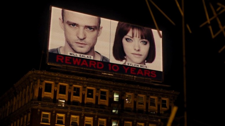 Billboard showing Will Salas and Sylvia Weis in In Time (2011)