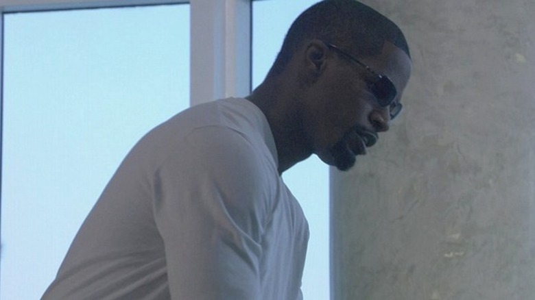 Ricardo Tubbs in a white shirt and sunglasses in Miami Vice (2006)
