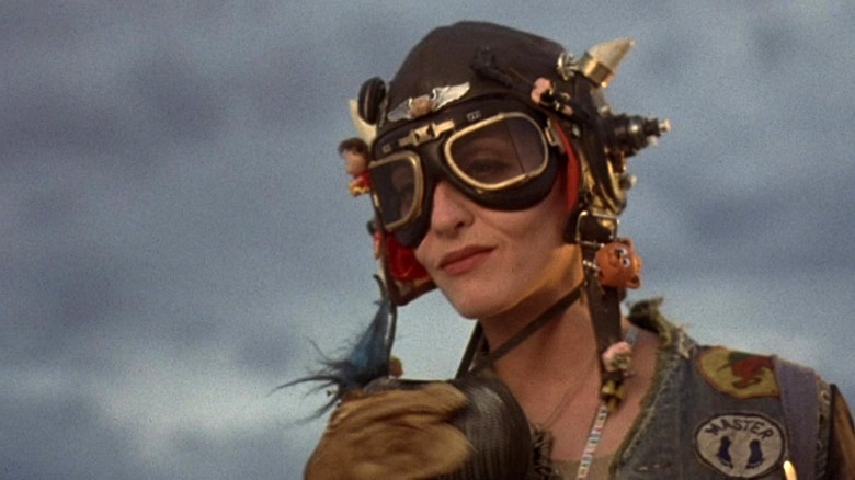 Tank Girl smirks while wearing goggles in Tank Girl (1995)