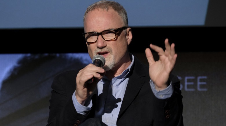 David Fincher holding microphone