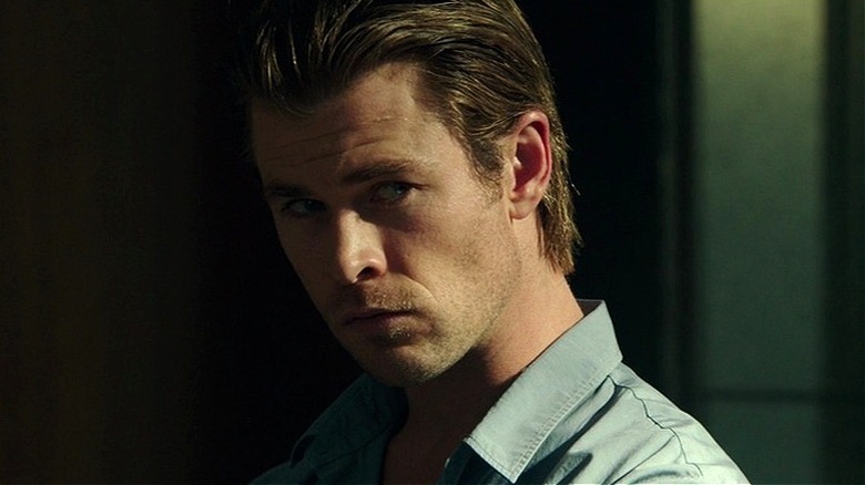 Nicholas Hathaway standing in the shadows in "Blackhat."