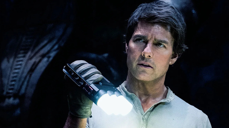 Nick holding a flashlight in "The Mummy."