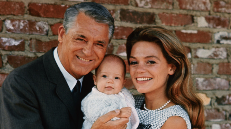 Cary Grant and Dyan Cannon holding their daughter