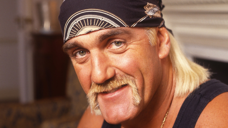 Hulk Hogan in black bandanna and tank tap