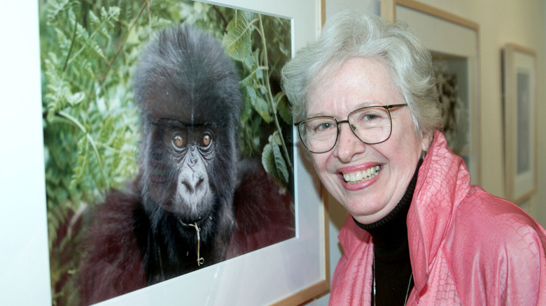Polly Holliday smiling with a picture of a gorilla