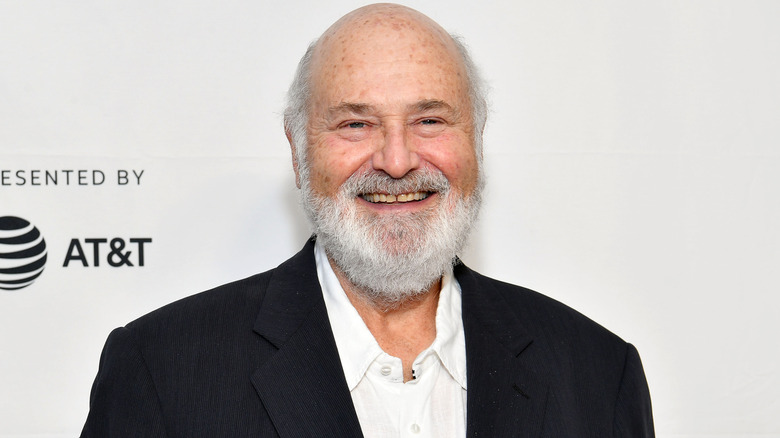 Rob Reiner smiling on the red carpet in 2025