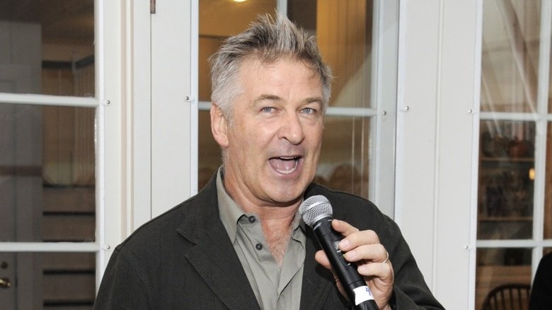 Alec Baldwin speaking with a microphone