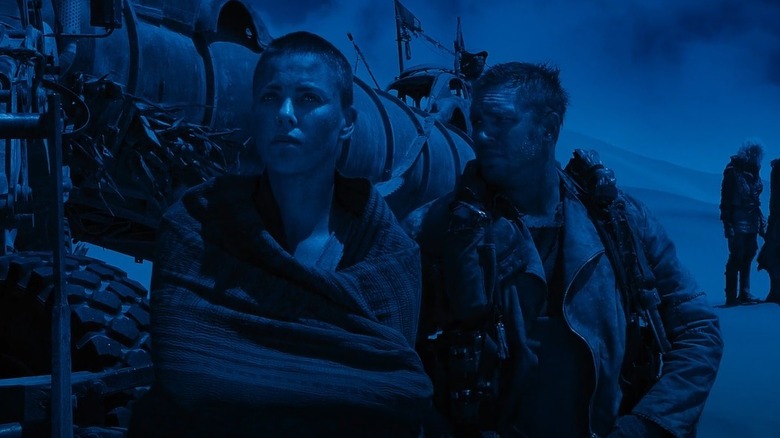 Furiosa standing in front of Max