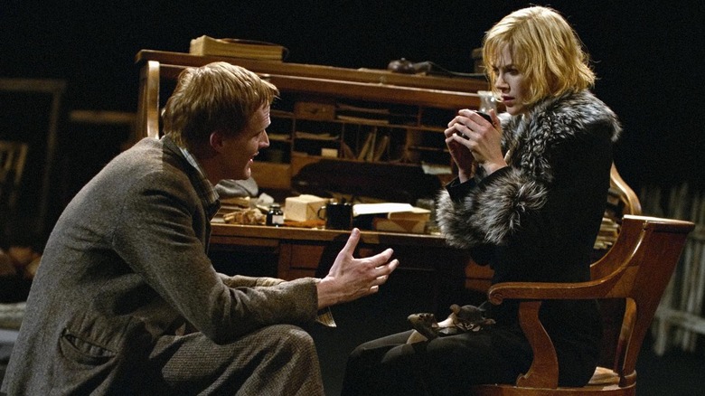 Tom pleads with Grace while she sits